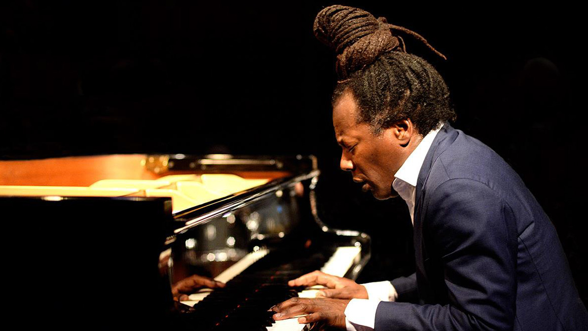 Ramón Valle performing live on stage, captivating the audience with his Afro-Cuban jazz piano. Book Ramón Valle through Originaria Events.