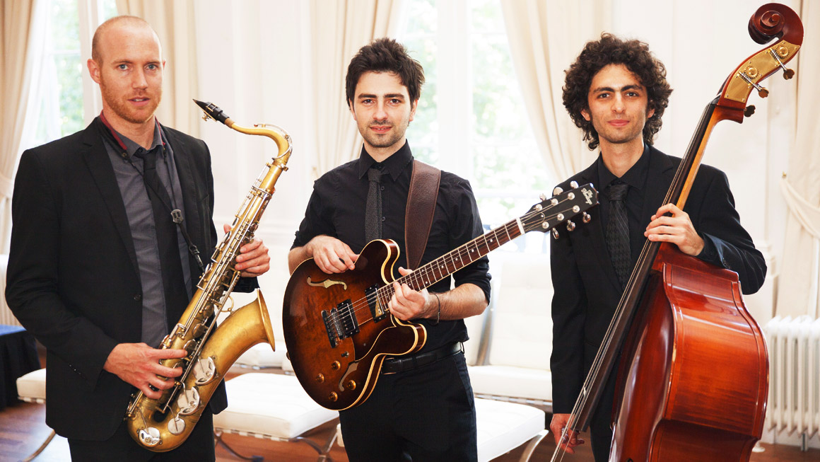 The Well Fitting Group performing live, blending jazz and pop, led by contrabassist Adán Mizrahi in an elegant event setting. Book Now Through Originaria Events.